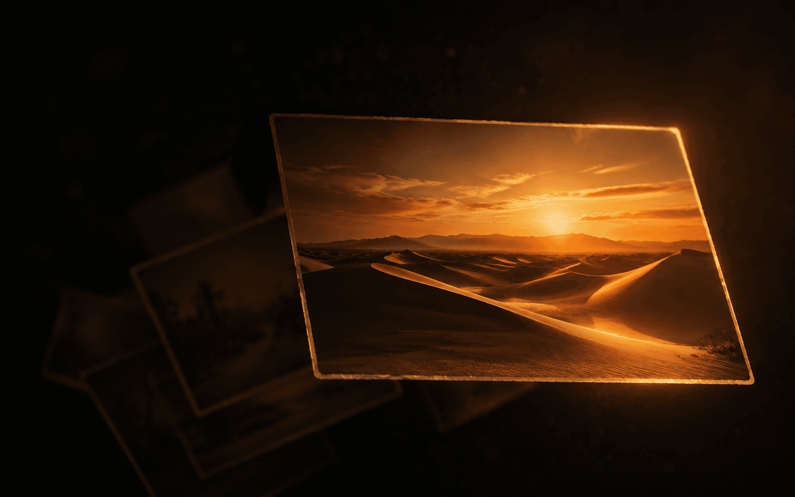 AD4x4 Gallery: a single photograph of desert dunes at sunset, lit warm amber and glowing at its edges, with more photographs falling away into shadow behind it.